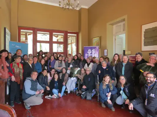 Las 55 personas cuidadoras y el equipo sociosanitario del programa